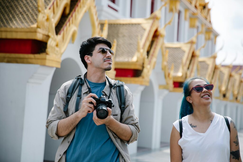 Man and Woman Wearing Sunglasses Looking Up