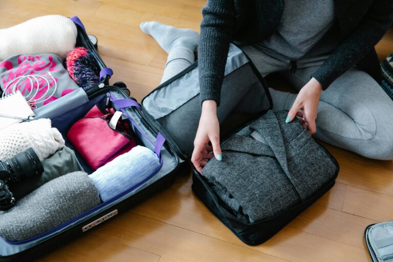 A Person Packing Up Things for his trip