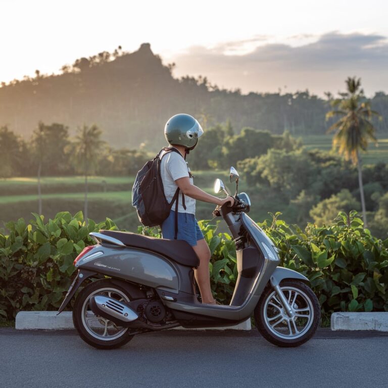 a solo traveler rents a scooter in Bali to explore it freely