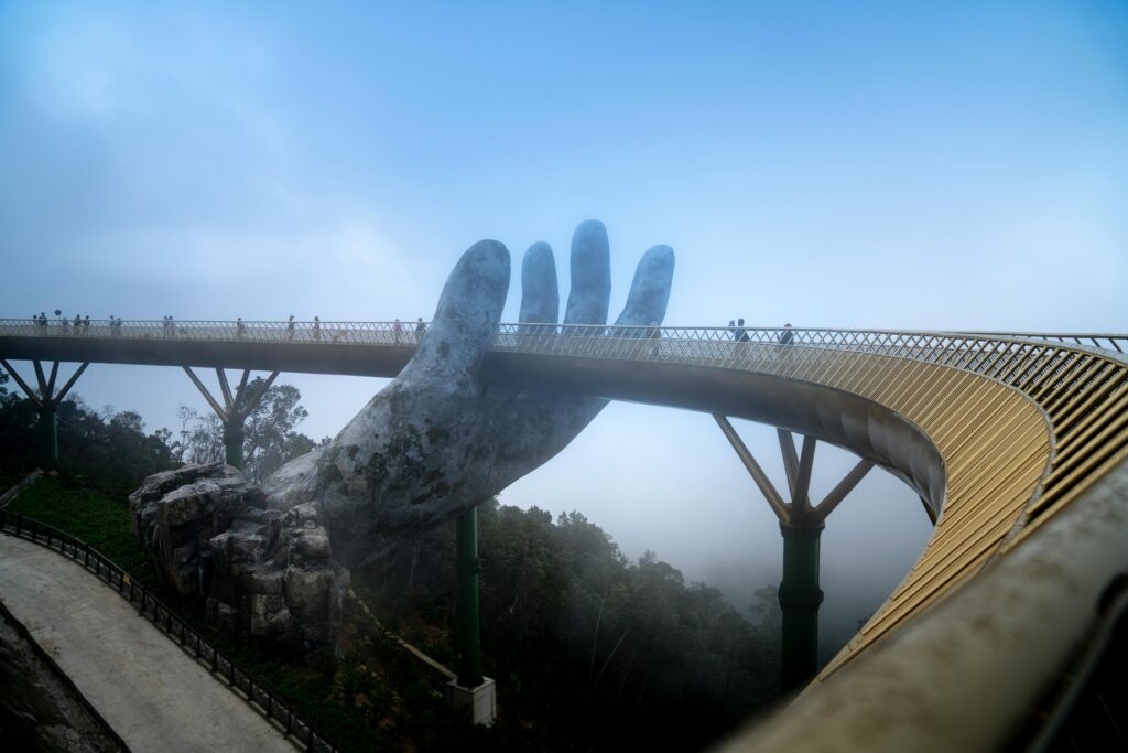 Golden Bridge in Vietnam with its iconic hand sculpture enveloped in foggy ambiance.